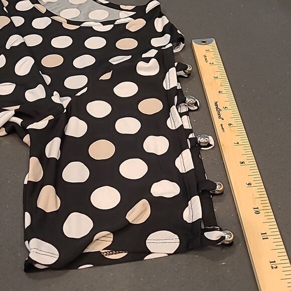 Black with cream polkadots with floral detailing around hem.  Peekaboo sleeves - Picture 5 of 10
